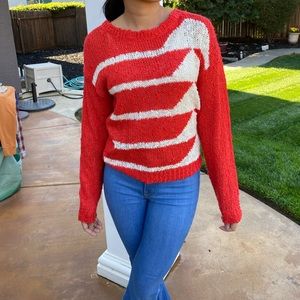 Distressed knitted sweater